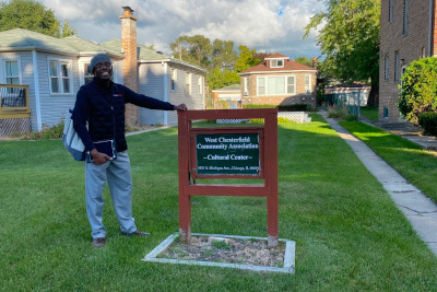 Tree Ambassador Dr. Doug Williams posing with the West Chesterfield Community Association Cultural Center sign in Roseland