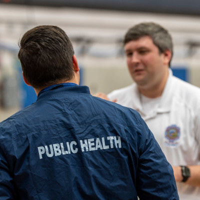 CDPH staff talking at event site