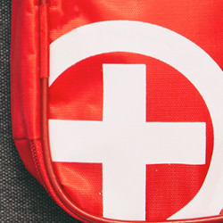 Emergency Preparedness menu image - red bag with white cross within a white circle