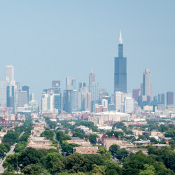 Environment menu image - aerial view of Chicago neighborhoods with skyline in background