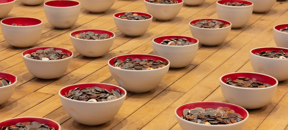 Forever in Your Debt (bowls of coins lined up on a floor)