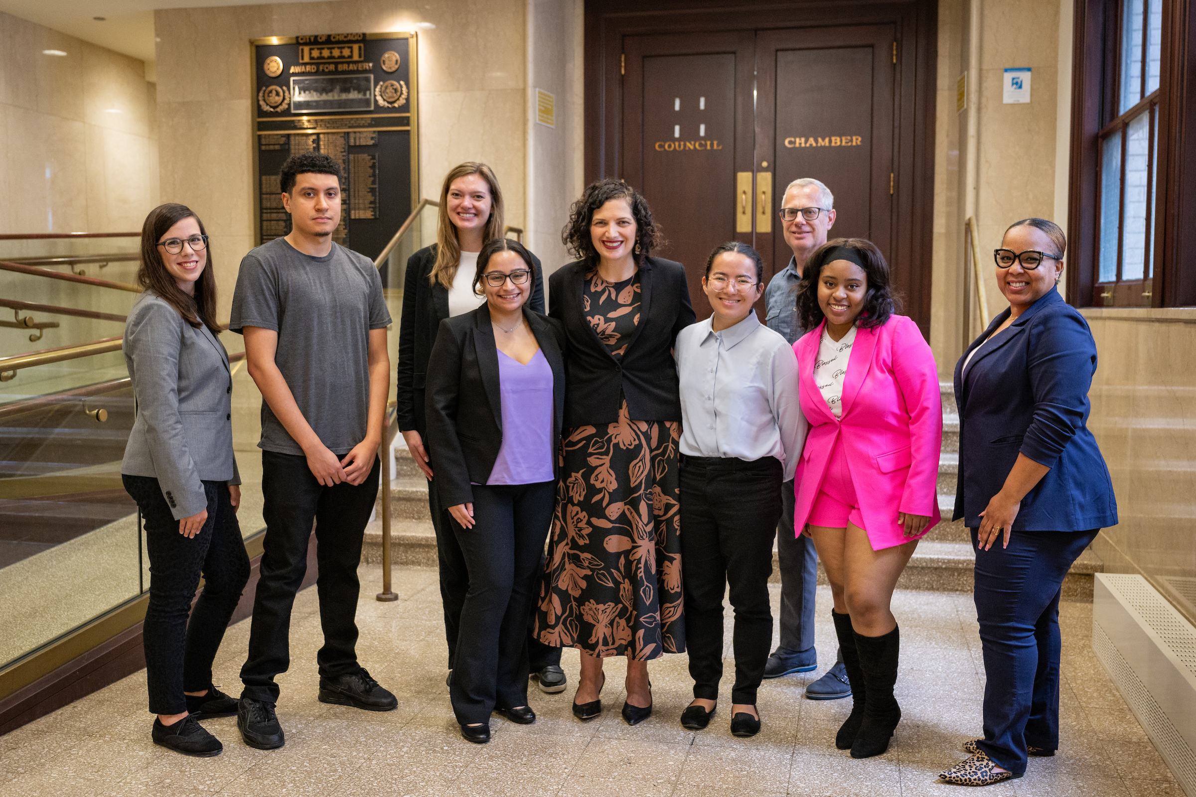 MOPD summer interns joined Commissioner Arfa (center, in patterned dress) for a City Hall and City Council chambers tour in 2023.