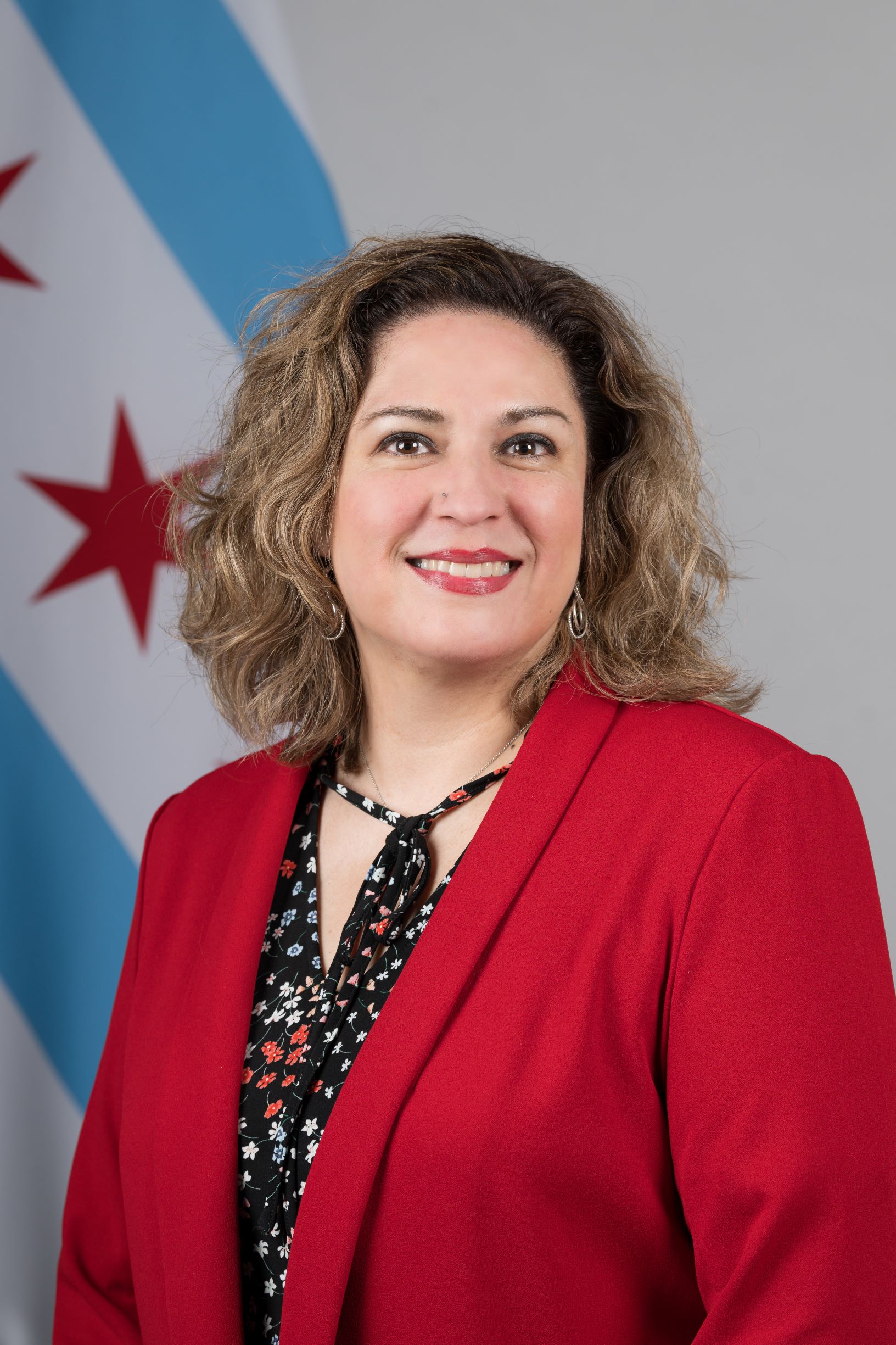 Headshot of MOPD representative Karla Castellanos in a red blazer