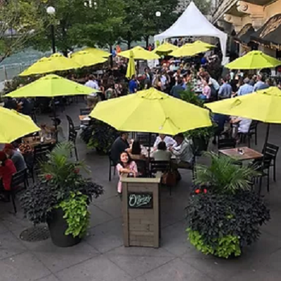 Outdoor dining tables with umbrellas.