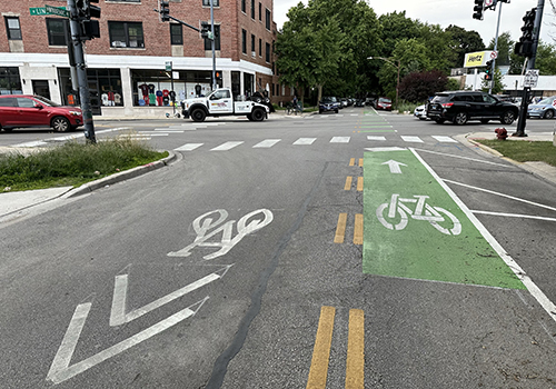 Street with bike symbol markings on the roadway