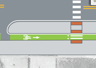 Person biking towards viewer in green painted bike lane separated from vehicle travel lane by concrete curb.