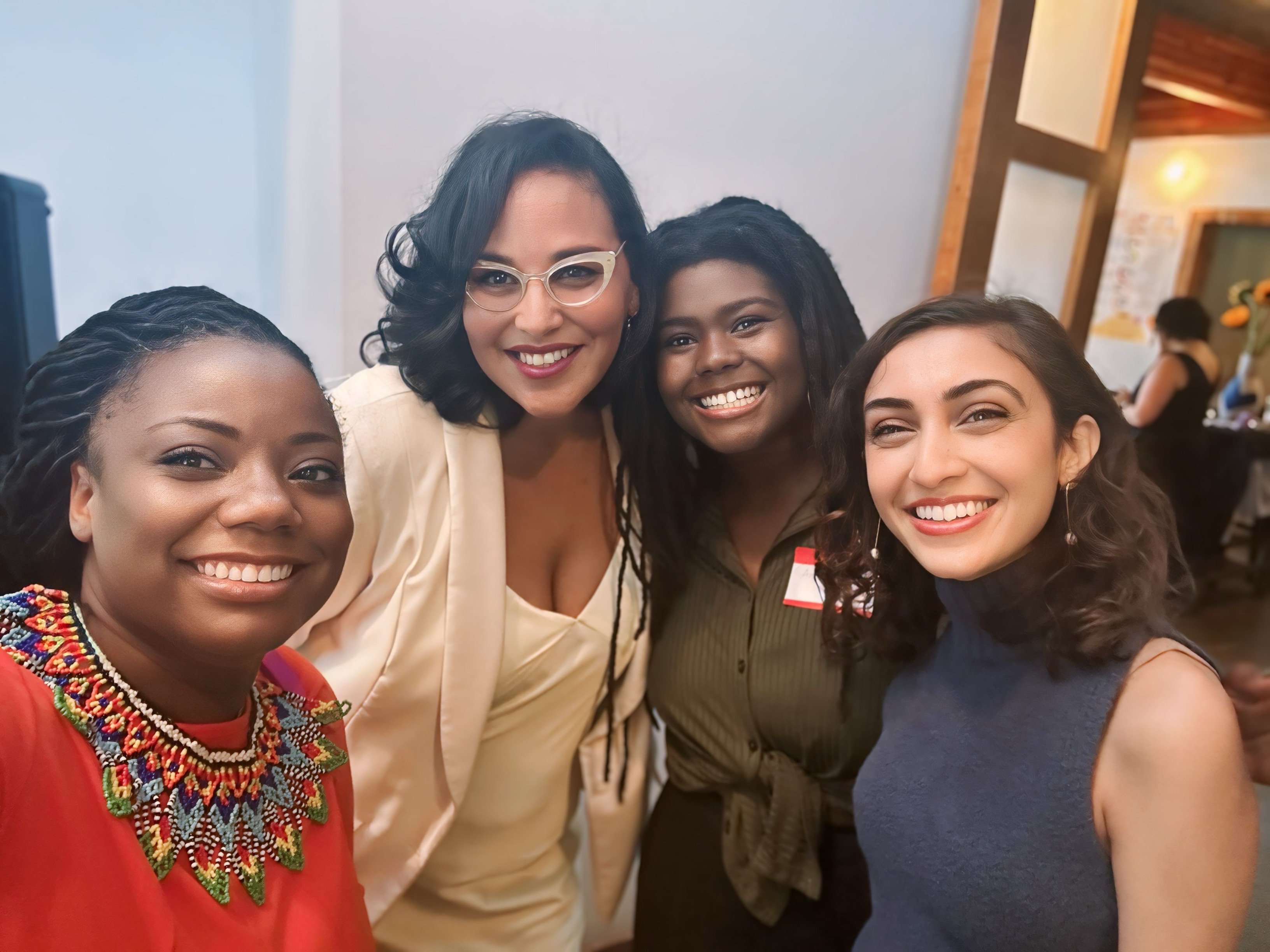 Selfie of four women smiling 